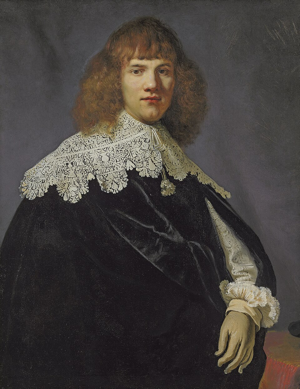 Portrait of a gentleman, half-length, in a black velvet cloak and white lace collar and cuffs - Rembrandt van Rijn